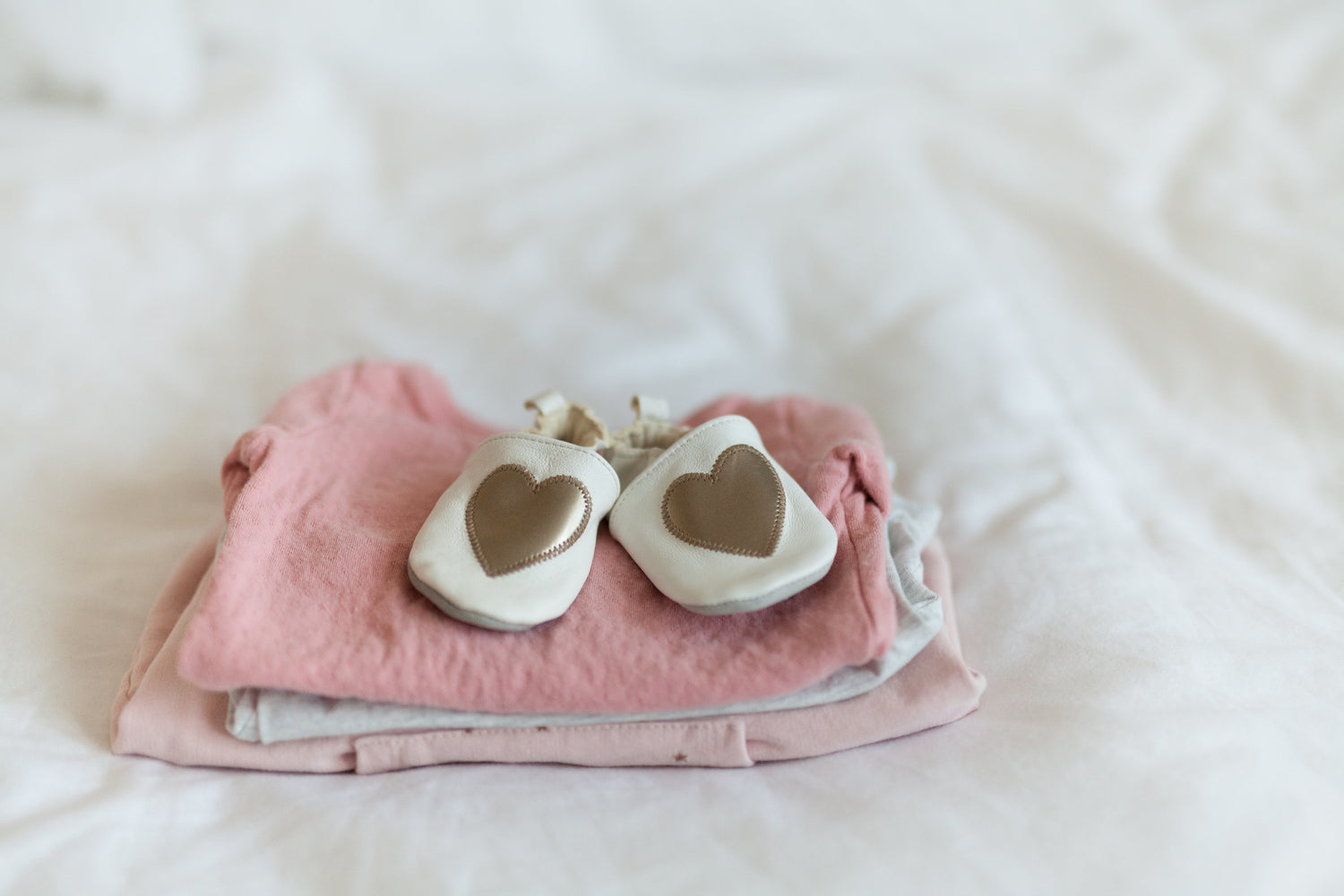 cute gold and white baby shoes