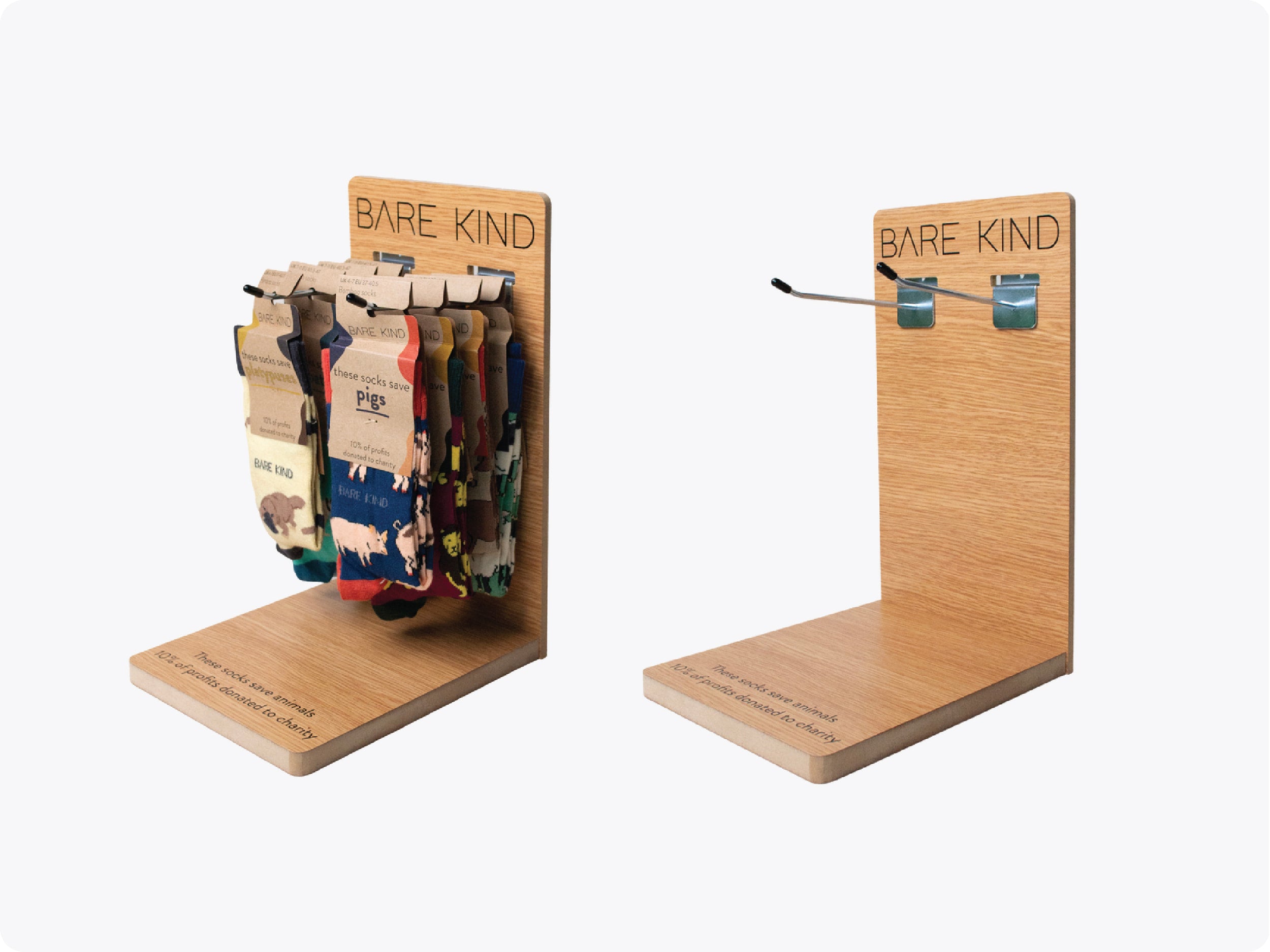 Bare Kind sock display stand with colorful socks on a white background