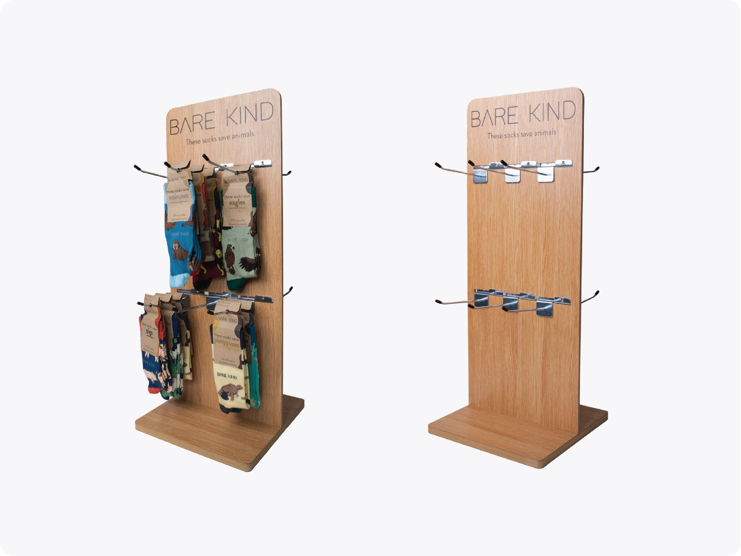 Wooden display stands with 'Bare Kind' branding on a white background