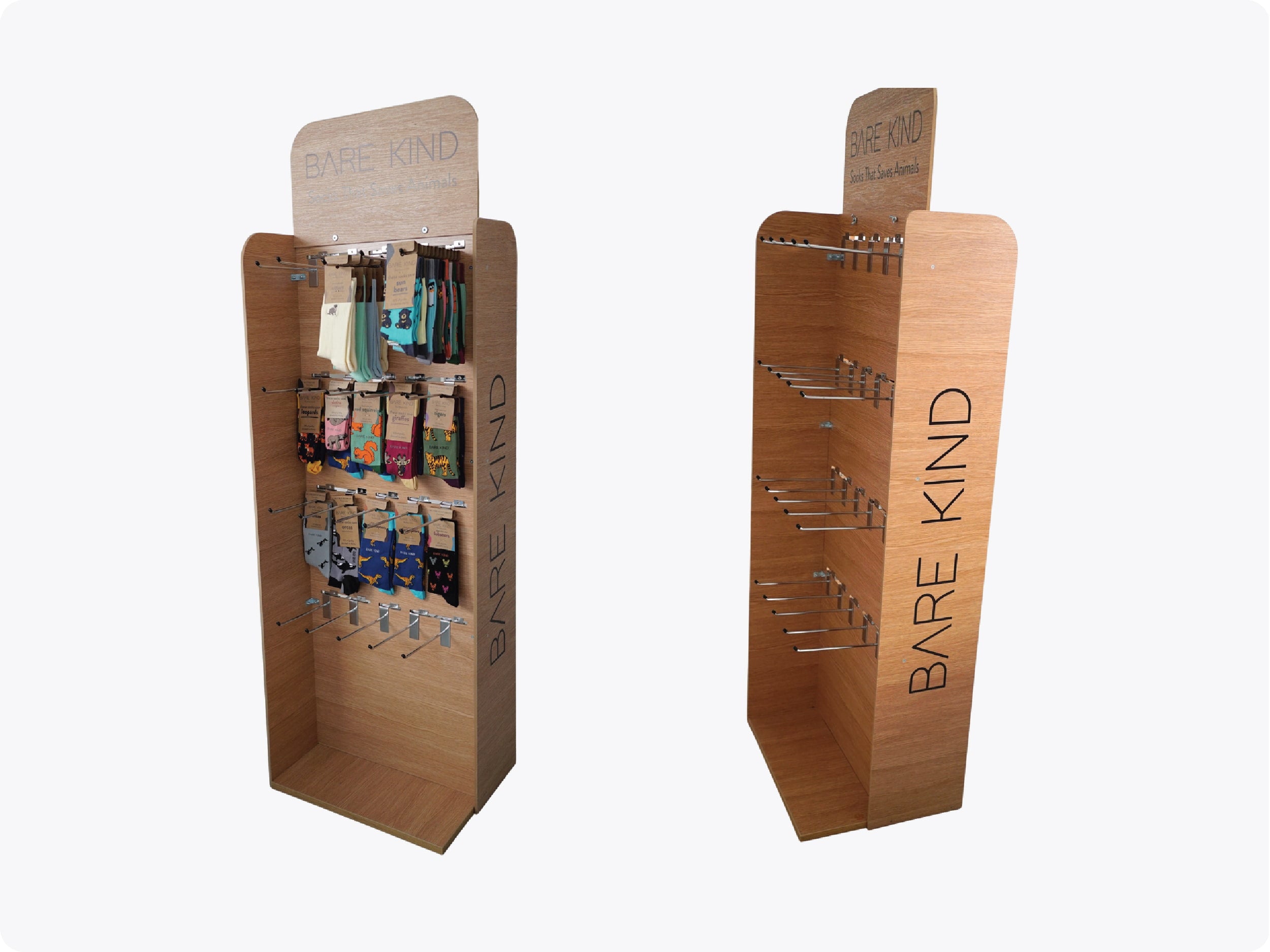 Wooden product display stands with 'Bare Kind' branding on a white background