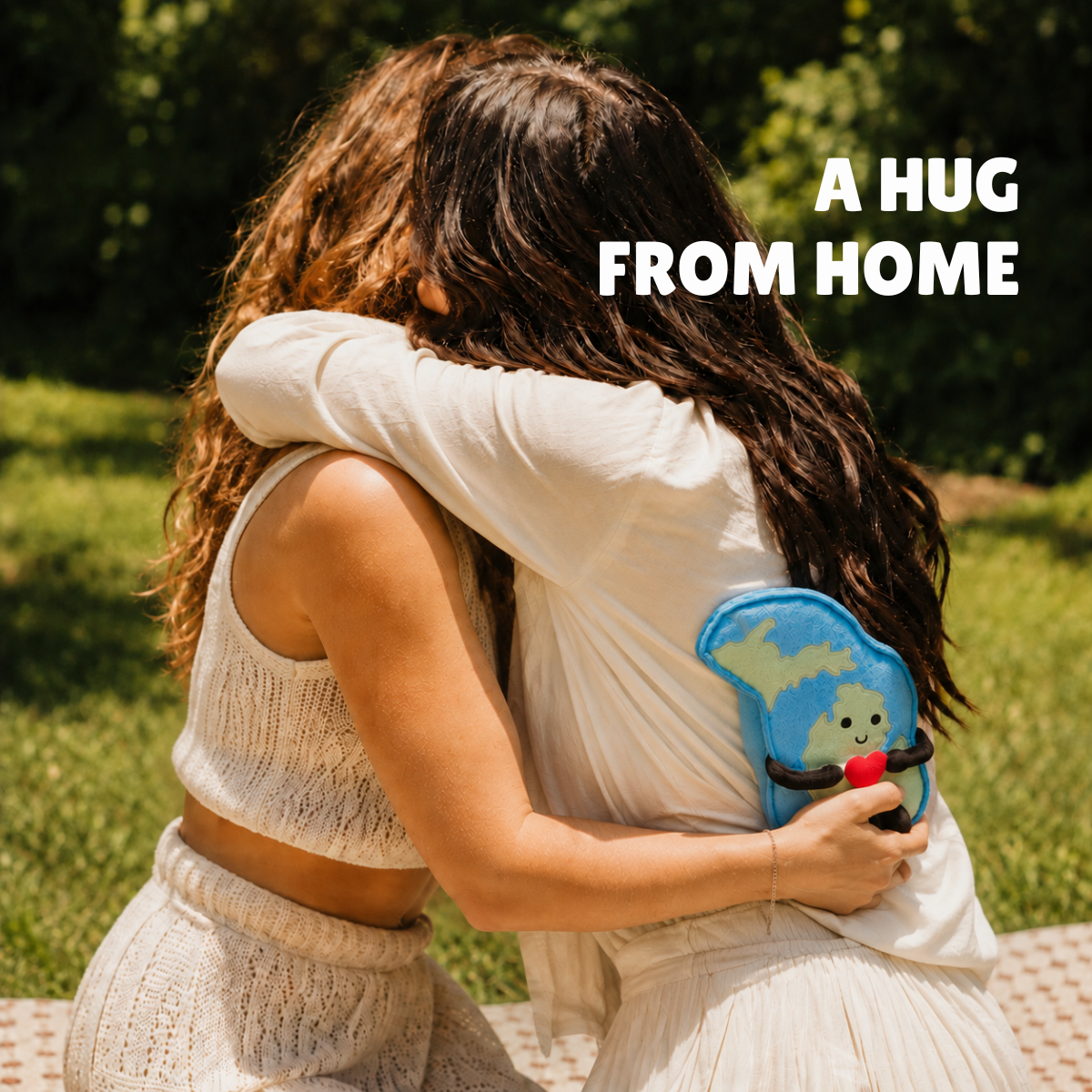Artwork of two people hugging outdoors with a Michigan plush